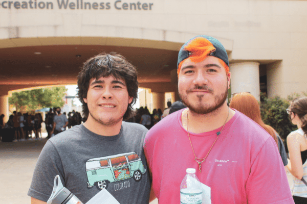 Two students outside the Recreation Wellbeing Center